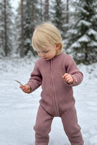 Children's zip coverall in Lavender with a winter background